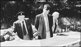 Frank Harvey, Garry Moore and deputy mayor Lesley Keast inspect the Victoria Park memorial to World War Two soldiers.