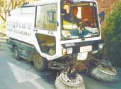 Grant Lousich, City Care field supervisor, demonstrates the cleaning sweeper