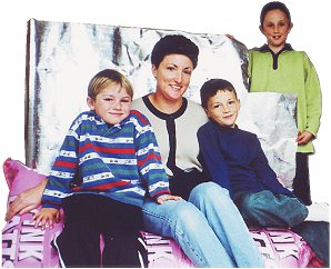 Tracey Washington takes delivery of insulation aided by her children (from left) Liam, Julian and Sophie.