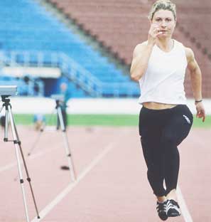 FLYING ATHLETICS CAREER . . . sprinter Debbie Gibb steps it out at QEII.