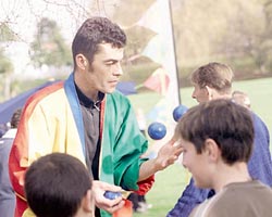 A juggler entertaining kids