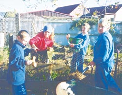 Kids from Belfast School in their edible garden