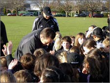 Mike Hammet talking to children at Black Out banner presentation