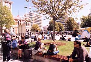 People enjoying the sun in the square
