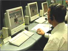 At Hitachi Communication Technologies the Mayor tested the latest in remote meeting equipment.   Tokyo, August 2005.