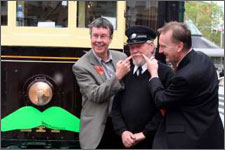 Mayor Garry Moore celebrating Movember. Putting a moustache on one a Christchurch Tram to advertise Mo-vember. Participants known as Mo Bros grow and groom their moustache during November and along the way raise as much money and awareness about male health issues as possible.