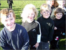 Children from St Albans Catholic Primary School attending Black Out Banner school presentation at Malvern Park with All Black, Mark Hammett.