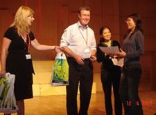 Mayor Garry Moore, in China, presenting the winner's prize for a Wuhan, China, high school student essay writing competition sponsored by Education Christchurch and the Wuhan Education Bureau. The essay topic was 'Why I want to go to New Zealand.