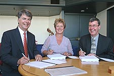 Mark Jack from HPH, Paddy Austin, Chair, CCHL, and Mayor Garry Moore signing agreements for HPH and CCHL to enter into a joint venture agreement regarding the Lyttelton Port Company